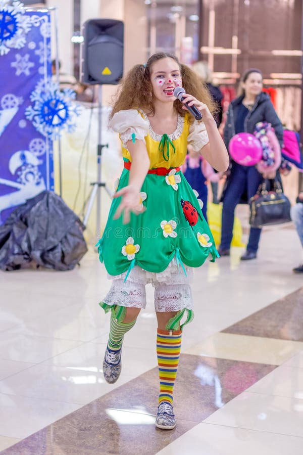 The festival of plasticine rain. Girl-mime in a fairy costume with a microphone in their hands. Russia, Samara, February 2018: the festival of plasticine rain royalty free stock images