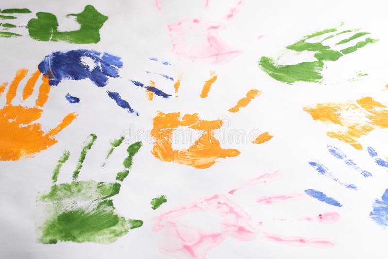 Set of handprints of children left with colorful paints on a white background, children`s creativity stock photography