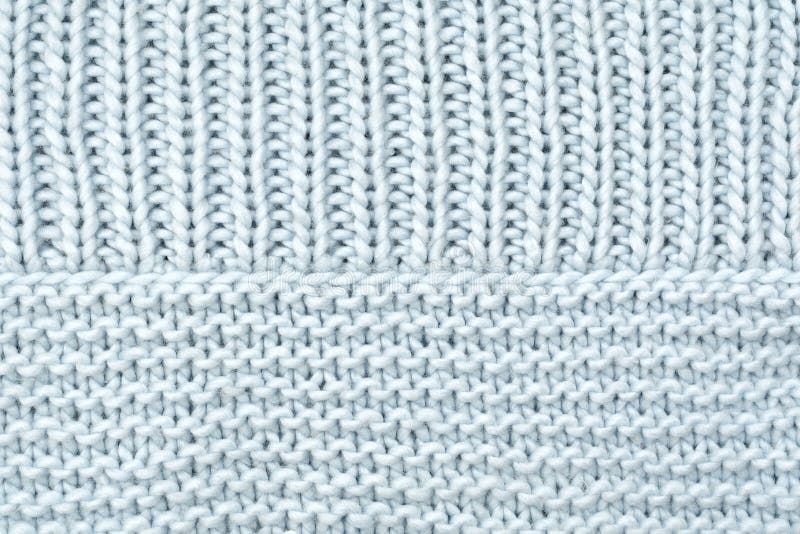 Texture knitted wool fabric from the front and purl loops.  royalty free stock photos