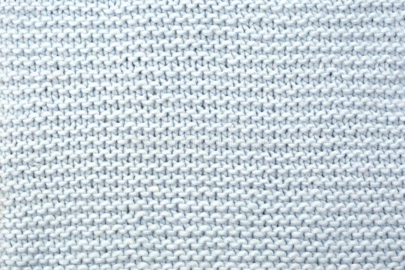 The texture of knitted woolen fabric from purl loops.  royalty free stock photography