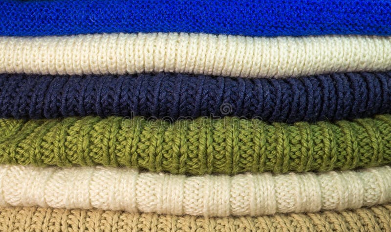 Texture. Stack of knittings. Colorful handmade knitwear. Texture. Stack of knitting sweaters. Colorful handmade knitwear royalty free stock photos
