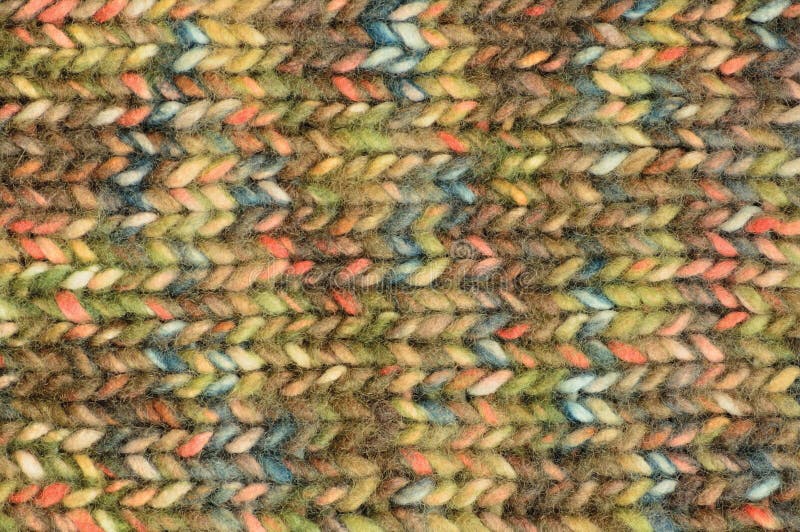 Warm green beige blue pink knitted wool melange blend handmade garment background, large detailed horizontal colorful textured. Woolen knitwear pattern, rough stock photos