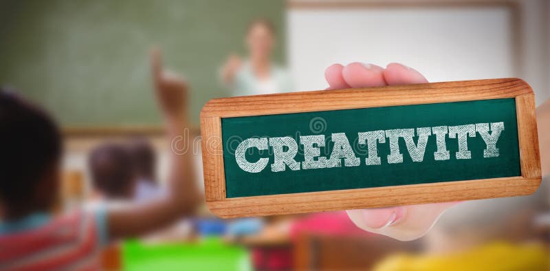 Creativity against pupils raising their hands during class. The word creativity and hand showing chalkboard against pupils raising their hands during class stock image