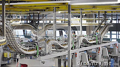 Freshly printed daily newspapers are transported on a conveyor belt in a printing plant stock video