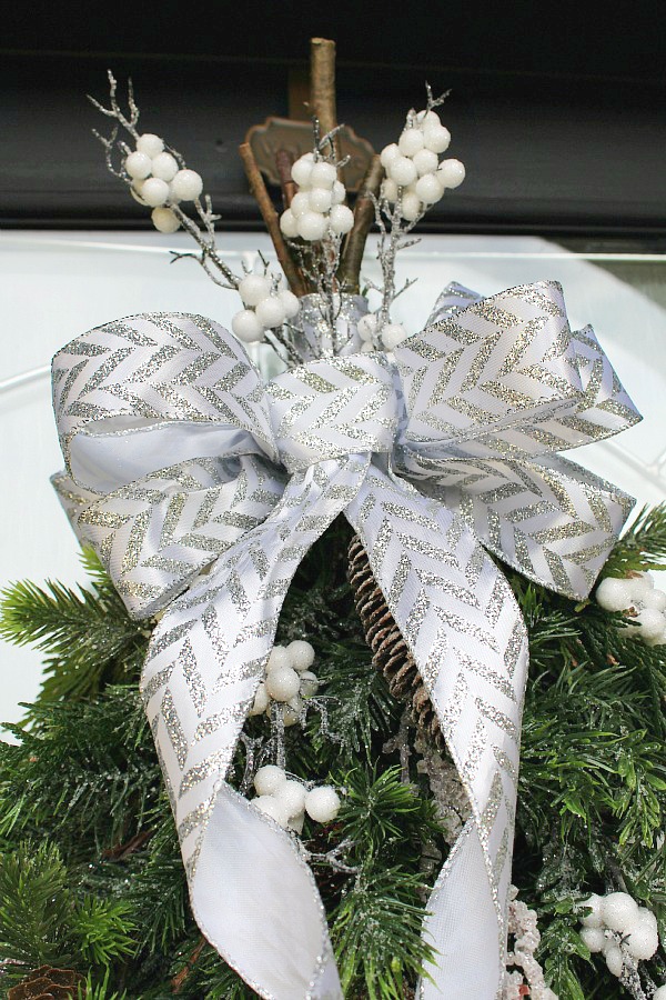 How to make a bow out of ribbon. Pretty bow made from ribbon on a swag wreath.